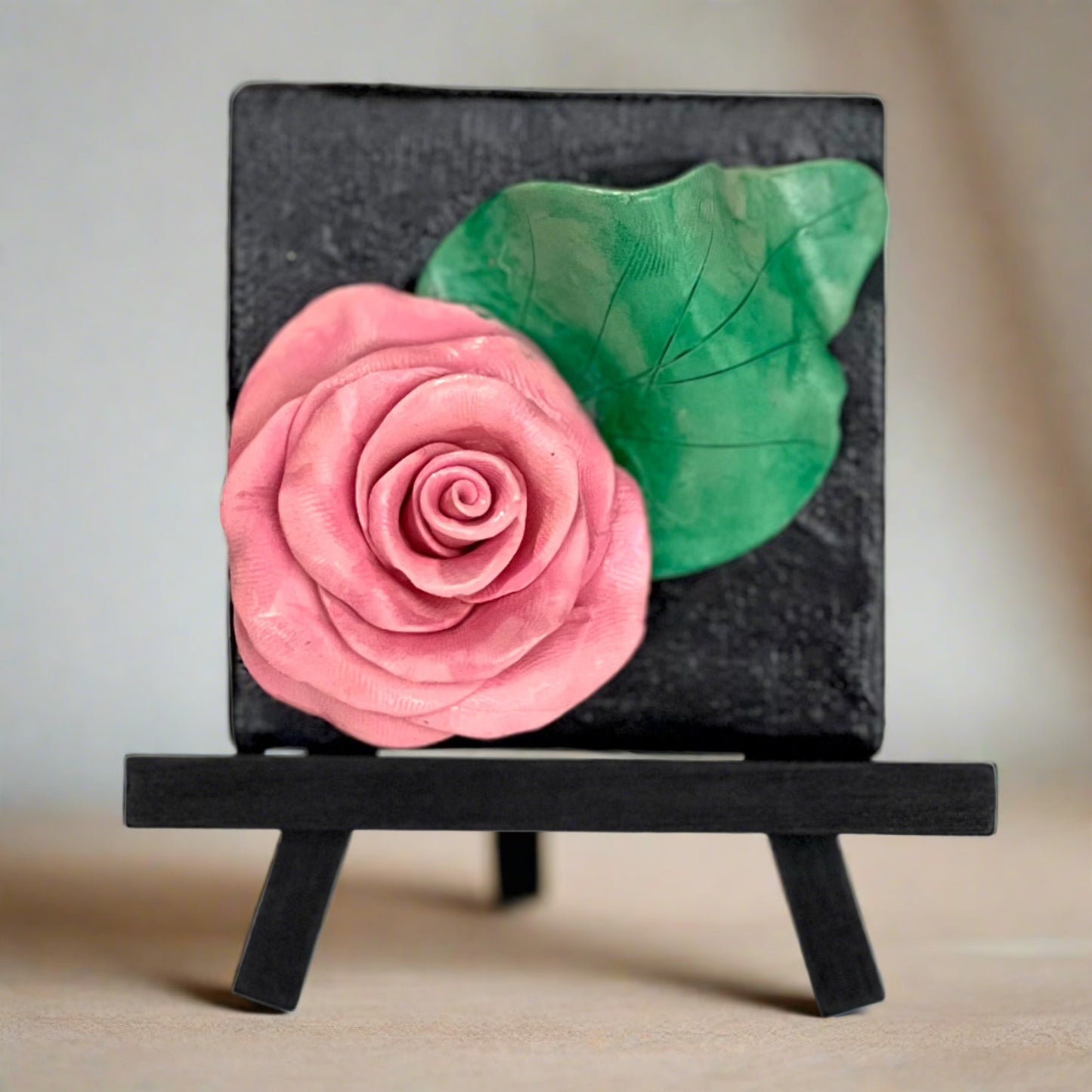 polymer clay flower on a canvas