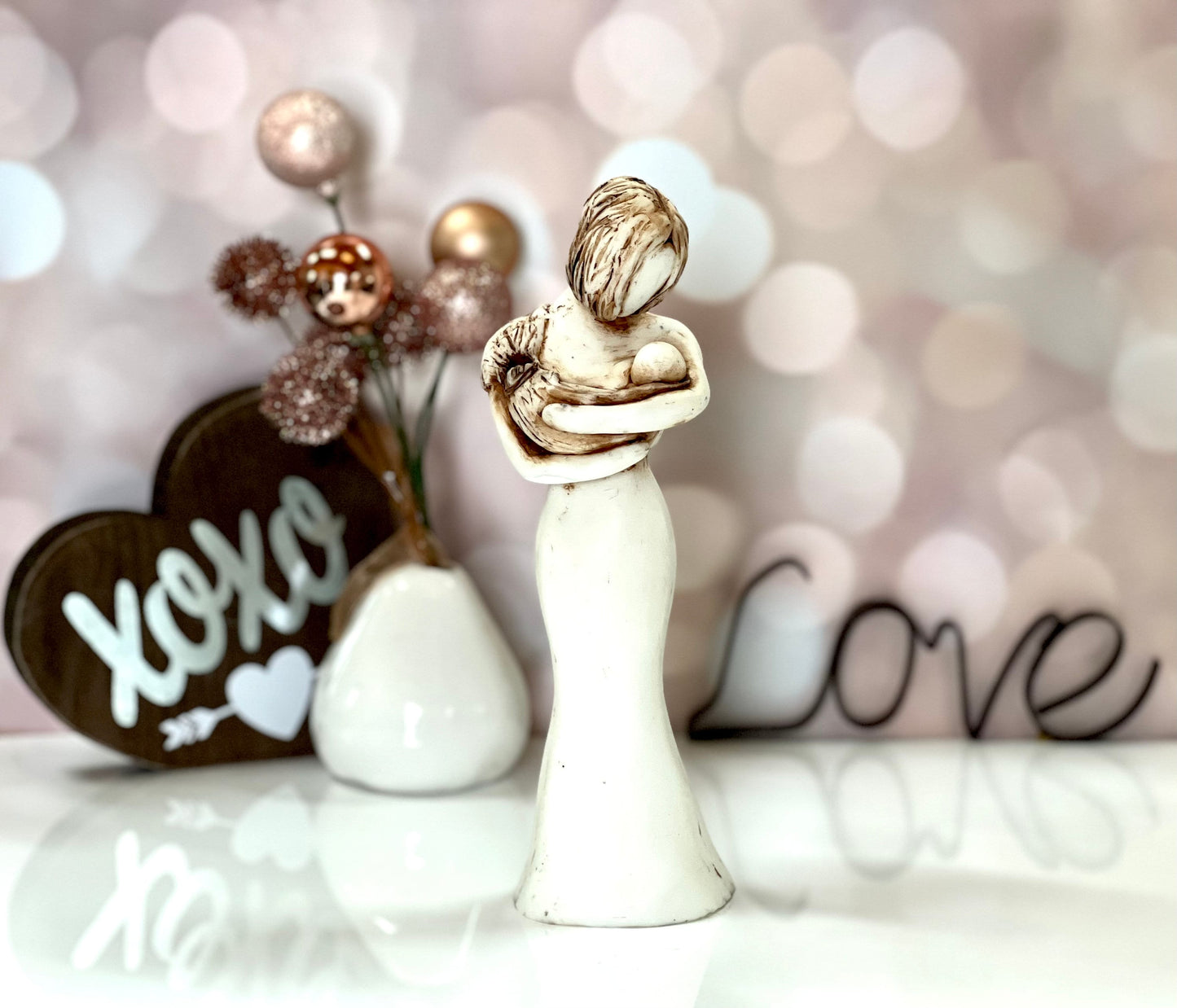 Love At First Sight Sculpture Of A Babywearing Mom
