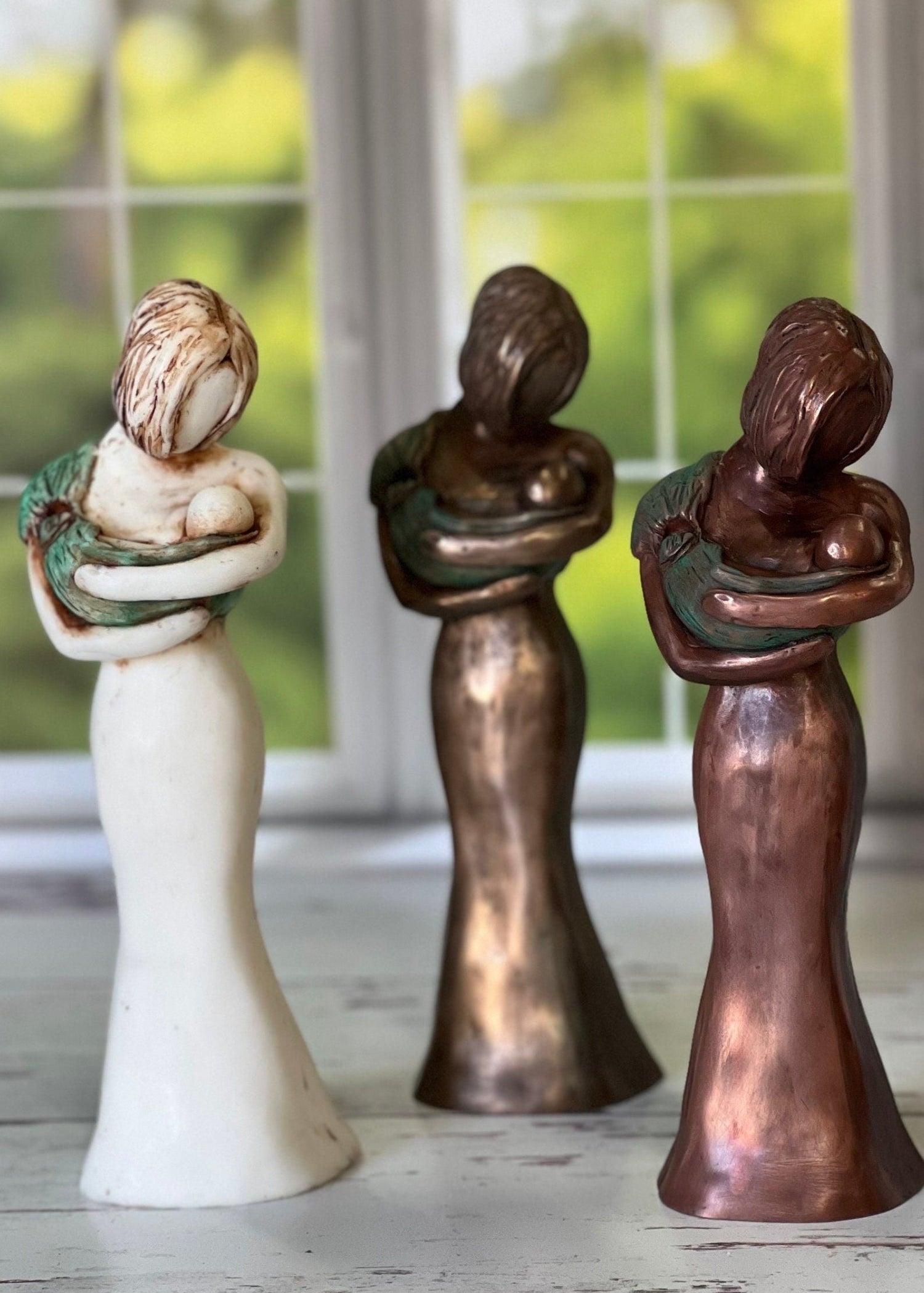 Love At First Sight Sculpture Of A Babywearing Mom